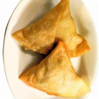 Veg Samosas · Triangular pastry stuffed with potatoes & green peas
seasoned with spices. 2 pieces