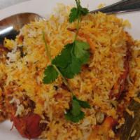 Chicken Biryani · Chicken cooked with basmati rice, ghee, aromatic herbs &
exotic spices.