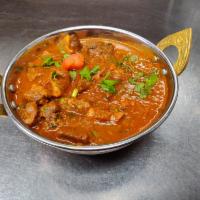 Goat Curry  · Goat meat with bone, traditional dish of Nepal, carefully seasoned with the exotic blend of ...
