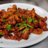 Chicken 65  · Marinated Fried Chicken sauteed with generous amount of
garlic and herbs