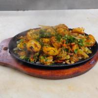 Tandoori Shrimp  · Shrimp marinated in a yogurt and curry spices, cooked in a
tandoor oven. 12 pieces