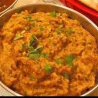 Baigun Bharta  · Eggplant roasted in a tandoor, cooked in a creamy sauce
with herbs & spices