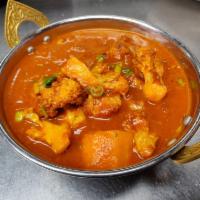 Aaloo Gobi · Great combination of potato & cauliflower cooked with onion
and tomato sauces and spices