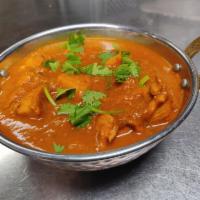 Chicken Vindaloo · Chicken and potatoes sauteed in a delight with
vinegar/lemon curry sauce