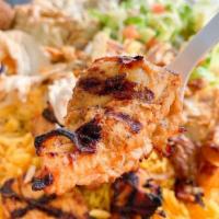 Chicken Kabab Plate · 2 grilled chicken skewers, marinated with garlic and herbs. Served with rice, hummus, salad,...