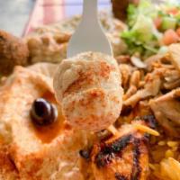 Lemon Chicken Plate · Marinated chicken breast, rice, salad, hummus and lemon sauce.