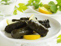 Grape Leaves · 5 grapes leaves stuffed with rice, tomato, onions, parsley and fresh lemon juice.