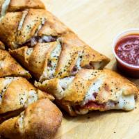 Pepperoni Stromboli · 8 pieces of stromboli packed with cheese and pepperoni, sprinkled with Italian seasoning and...