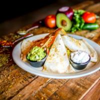Quesadilla · A large flour tortilla stuffed with melted mixed shredded cheeses and your 