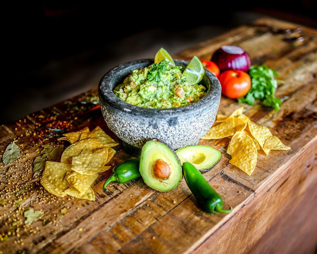 Guacamole · We use the freshest of avocados, tomato, onions, cilantro, chopped jalapeno peppers, lime juice, and a special blend of sea salt, pepper and garlic.