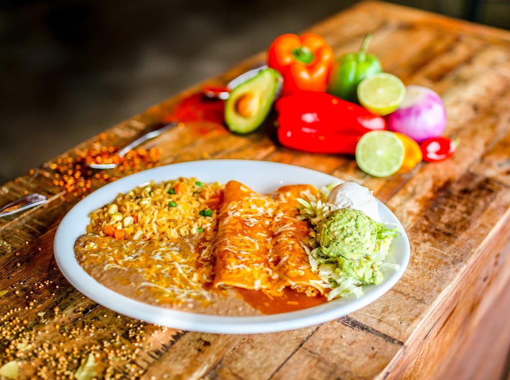 Enchiladas Mexicanas · Three shredded chicken enchiladas covered with queso dip, lettuce, tomatoes, sour cream guacamole. Served with Mexican rice and refried beans.