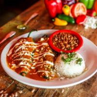 Dos Poblanos · Mild poblano chiles stuffed with jack cheese, shredded chicken, smothered with red sauce and...