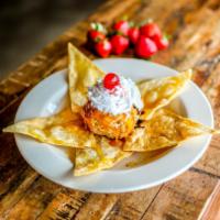 Fried Ice Cream · Vanilla ice cream covered with crispy corn flakes, sweetened with cinnamon and sugar, and th...