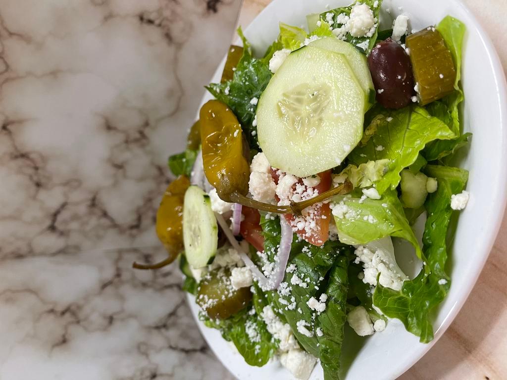 Greek Salad (Large) · Blend of romaine lettuce tomato onion cucumber & kalamata olives with feta cheese & our house greek dressing