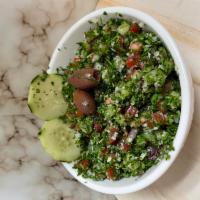 Tabbouleh Salad · Finely chopped parsley bulgur tomato onion & spices mixed in lemon juice & olive oil