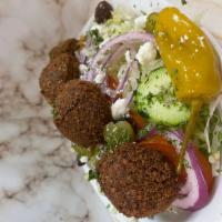 Falafel Salad Bowl · Five pieces of falafel over our Greek salad
