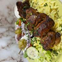 Lamb Kabob Plate · Flame grilled marinated cubed lamb cooked with our special seasoning - served with salad ric...
