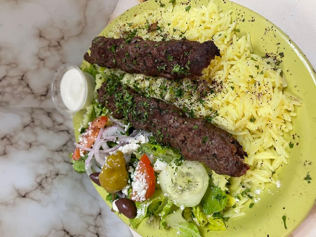 Kafta Kabob Plate · Flame grilled marinated ground beef flattened & cooked with our special seasoning - served with salad rice & pita