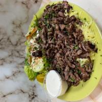 Lamb Shawarma Plate · Thinly sliced marinated boneless lamb mixed with our special spices - served with salad rice...