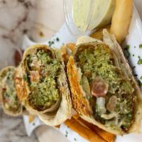 Falafel Wrap · 4 pieces of falafel wrapped with tortilla bread with pickle onion tomato & garlic sauce - se...
