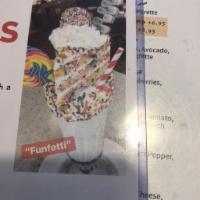 FunFetti Shake · Frosted Glass with Rainbow Sprinkles,Topped with FunFetti Cake, Whipped Cream, a Sour Belt, ...