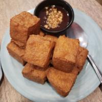 Homemade Crispy Tofu (9pcs) · Cubes of our homemade tofu are fried to a golden brown and served with our special brown sau...