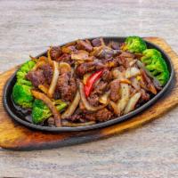 Black Pepper Beef · This is a Thai favorite! Steak is stir-fried with onions, bell peppers, and then caramelized...