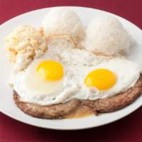 59. Loco Moco · Hamburger patties over rice covered with brown gravy and topped with eggs.