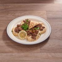 Shawarma Plate · Tender sliced beef, chicken or lamb shawarma marinated with onions, garlic and vinegar and t...