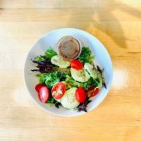 Green Salad · Mix spring, cucumber, tomato, pumpkin seed and Lemon dressing.