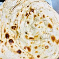 Latchha Paratha · Traditional Punjabi whole-wheat layered bread. Served plain or with butter. Vegan.