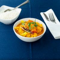 Aloo Ghobi · Cauliflower and potatoes sauteed with tomatoes and onions with fresh Indian spices. Vegan.