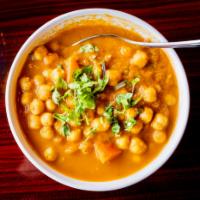 Chana Masala · Chickpeas, onions and ginger cooked in with Indian spices and tomato sauce. Vegan.