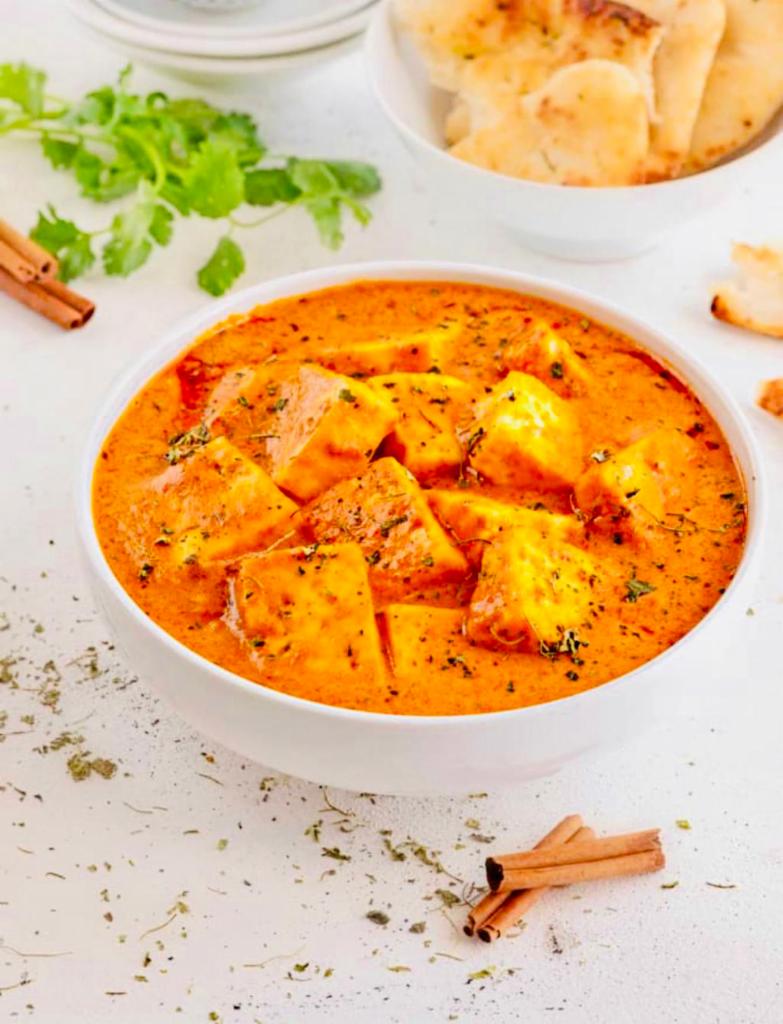Paneer Tikka Masala · Indian cottage cheese cubes grilled to perfection and cooked in gravy with bell peppers, onions, tomatoes and Indian spices.
