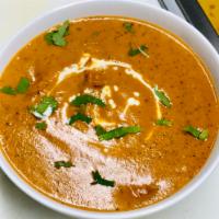 Dal Makhani · A mixture of lentils and kidney beans cooked with fresh Indian spices.