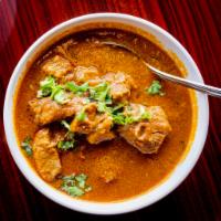 Lamb Curry · Lamb sauteed in traditional curry with a mix of herbs and spices.