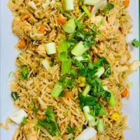 Chicken Fried Rice · Rice tossed with ginger, garlic and vegetables with Indo-Chinese spices.