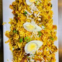 Lamb Biryani · Basmati rice cooked with herb and spices with lamb. Seasoned vegetables, onions, peppers and...