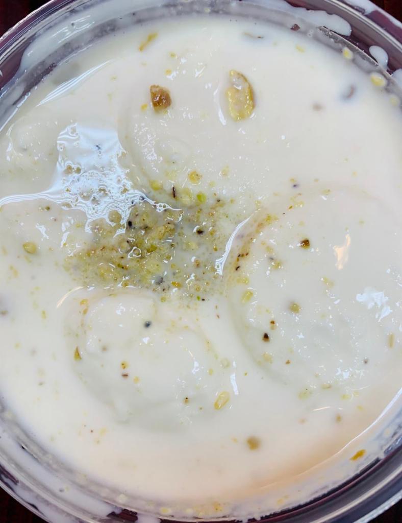 Rasmalai · Homemade cheese in chilled sweet milk with cardamom and pistachio.