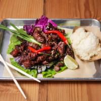 Candied Beef with Sticky Rice · Flash fry homestyle beef jerky perfect with beer. Gluten free.