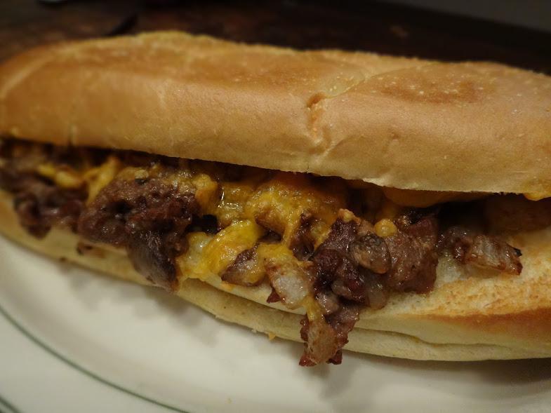 Philly Cheese Steak · Seasoned beef rib steak, mushrooms, onions and melted American cheese. Served with french fries.