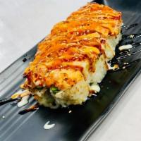 Sexy on the Beach Roll · Shrimp tempura, avocado, wrapped with soy paper, top with bake snow crab and crawfish mix, d...