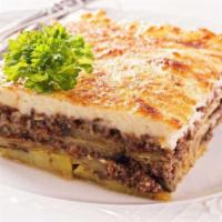 Moussaka · Layered eggplant, zucchini, ground beef, and creamy béchamel sauce baked together to golden ...