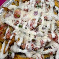 Nachos · Mixed cheese, black beans, cotija cheese , sour cream, and pico de gallo, pickled Jalapeno's.