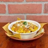 Esquites de Elote · Corn off the cob, sautéed with diced poblanos peppers, topped with chipotle mayo and cotija ...