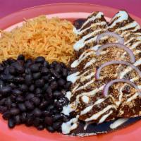 Pollo Asado Enchilada · Marinated grilled chicken in oven baked rolled tortillas, mole or verde sauce topped w/ sour...