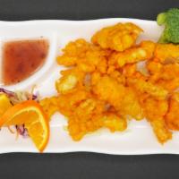 12. Golden Squid · Calamari dipped in tempura batter and lightly fried until golden brown. Served with sweet an...