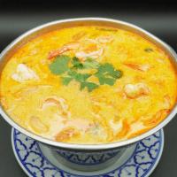 17. Tom Kha Soup · Coconut milk soup with lemongrass, galangal root, kaffir lime, onion, cilantro, cabbage and ...