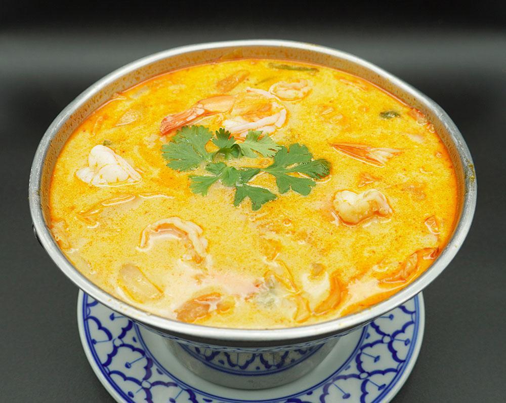 17. Tom Kha Soup · Coconut milk soup with lemongrass, galangal root, kaffir lime, onion, cilantro, cabbage and mushrooms. Choice of meat.