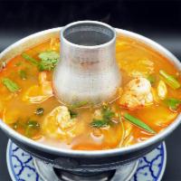 18. Tom Yum Soup · Most popular Thai hot and sour soup with fresh mushrooms, lemongrass, galangal root, kaffir ...